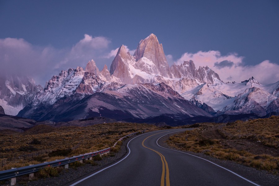 Hikers traversing a rugged trail in the Patagonian mountains